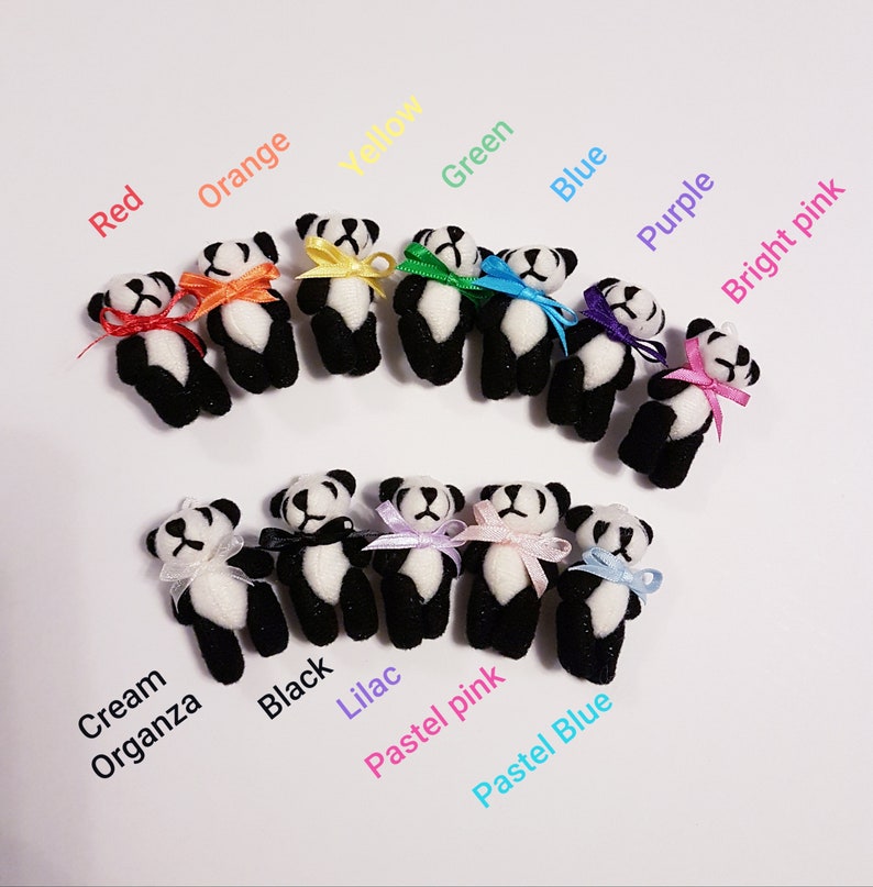 Miniature panda bears are arranged in 2 curved rows. The top row has 7 bears, each with a different coloured ribbon bowtie in rainbow colours from left to right. The bottom row has pandas with cream organza, black, pastel lilac pink and blue bow ties. Each panda has a text description of the colour beside it