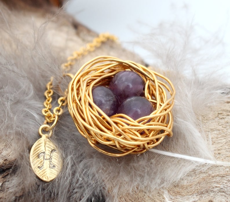 Gold coloured woven wire and purple amethyst eggs necklace with gold coloured leaf charm with stamped calligraphic H initial